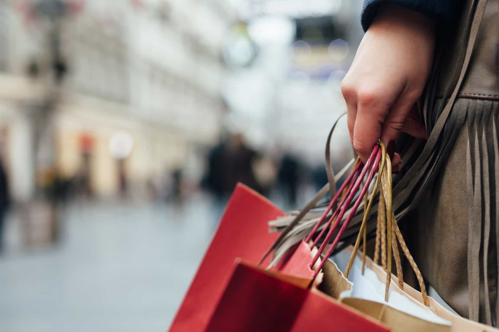 holding shopping bags