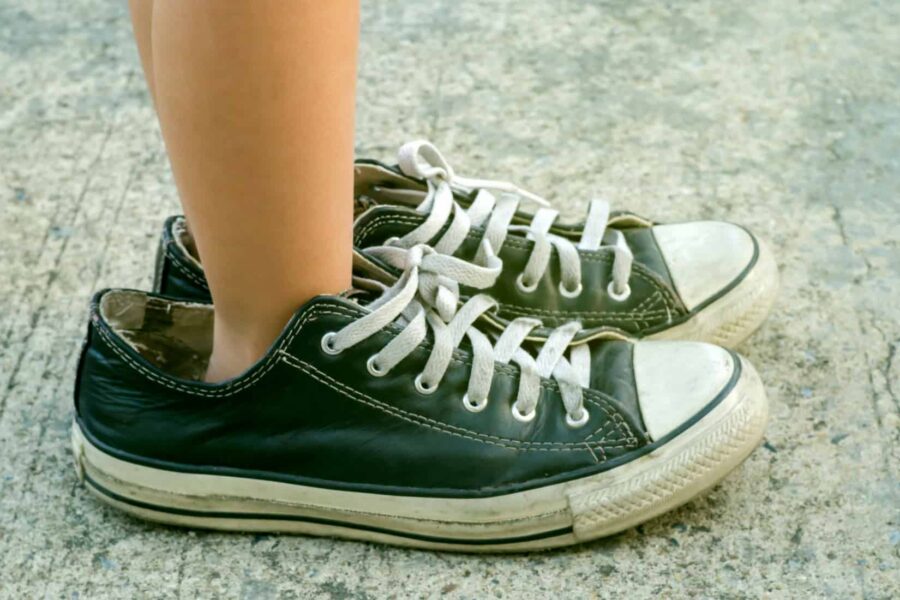 kid-wearing-adult-shoes