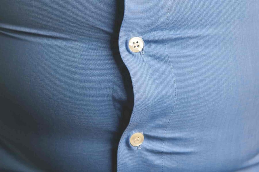 mans tight shirt buttons